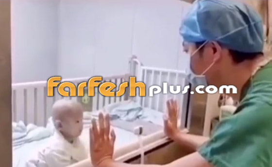 مشهد يدمي القلب.. رضيع صيني مصاب بفيروس كورونا في ووهان! صورة رقم 2