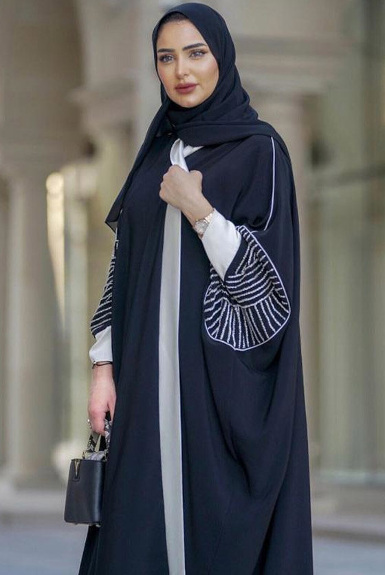 بالصور: أجمل العبايات السوداء موضة الموسم من الفاشينيستا المحجبات صورة رقم 10