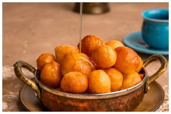 اللقيمات الإماراتية.. حلوى شهية تزين مائدة رمضان صورة رقم 4