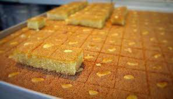 طريقة عمل.. صينية البسبوسة باللوز والسكر صورة رقم 6